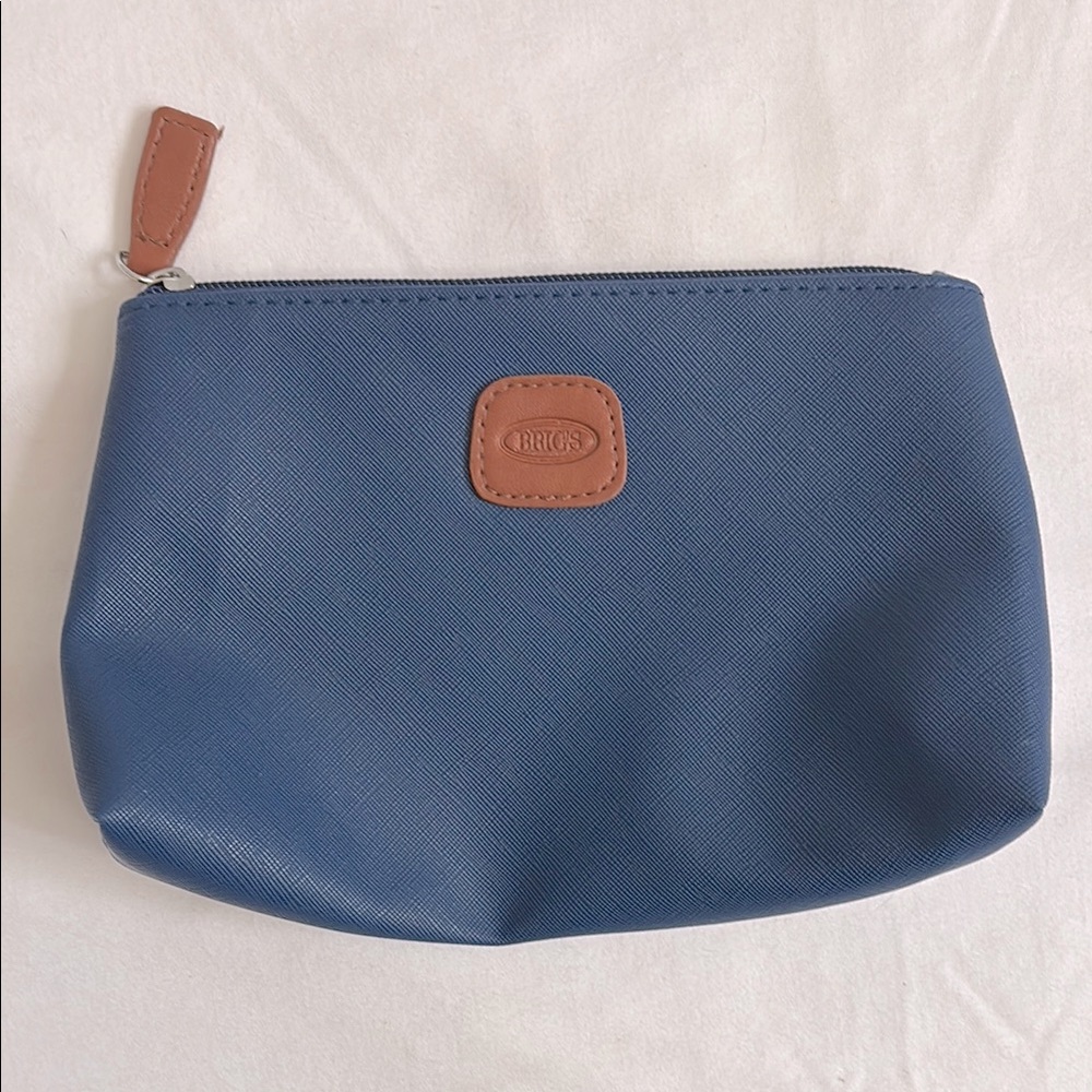 Bric’s crossgrain faux leather zip pouch with faux leather zipper pull
